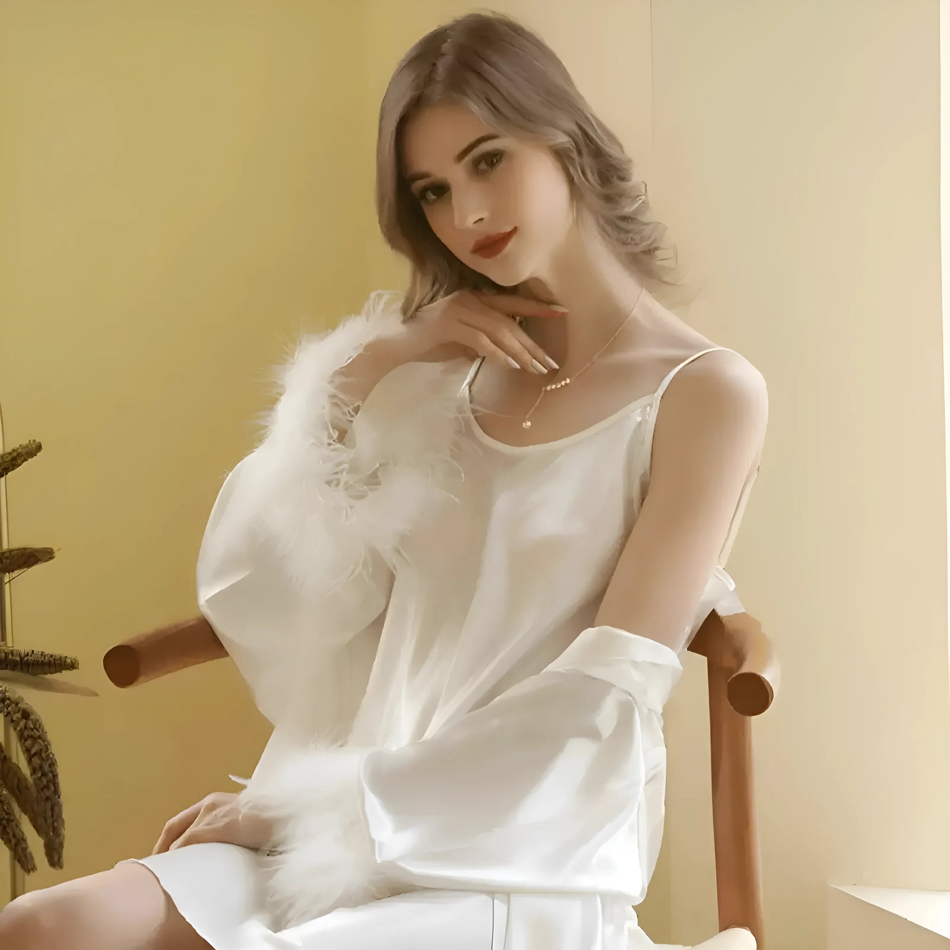 Robe de mariée avec des plumes