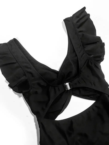 Maillot une pièce noir gainant à résille contrastée